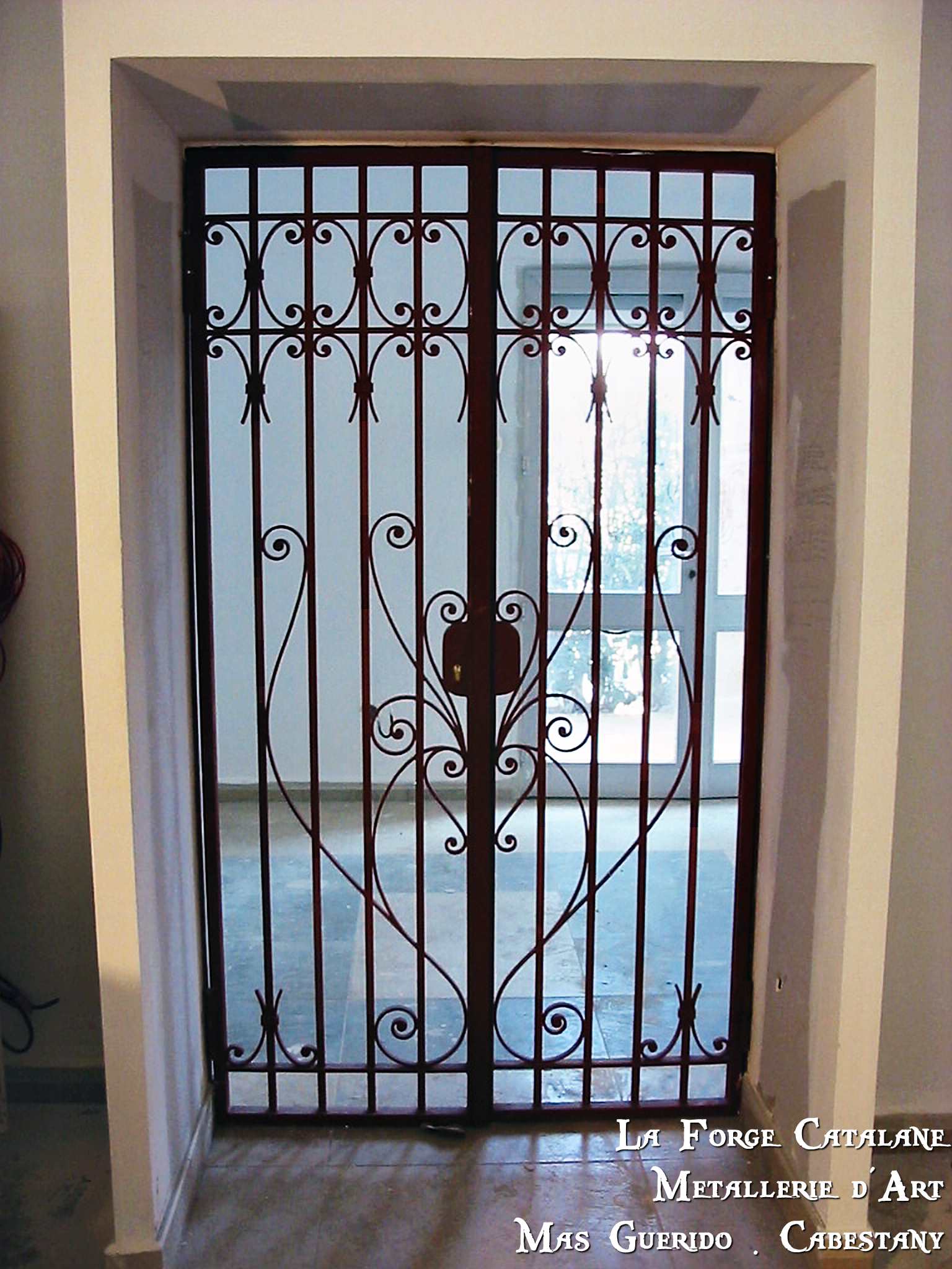 grille articulee volutes la lagune saint cyprien interieur type mauresque forge catalane 2.jpg